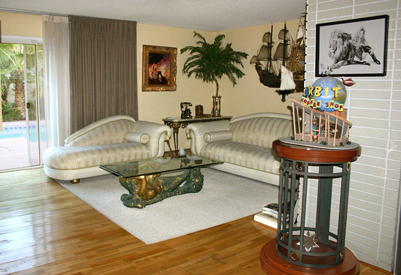 Living room with models from To the Ends of Time and Orbot diner from Atomic City-solar home lighting is on timers